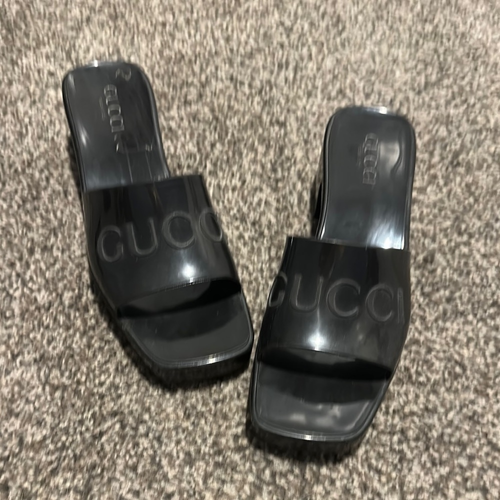 Gucci Black Leather Mules with Embossed Logo